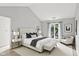 Serene bedroom with vaulted ceilings, neutral decor, and a large window with natural light at 9578 Cadbury Cir, Indianapolis, IN 46260