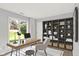Well-lit office space with large window, desk, chair, and custom shelving unit at 9578 Cadbury Cir, Indianapolis, IN 46260