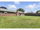 Brick home with a large backyard featuring a well-maintained lawn and a patio area for outdoor enjoyment at 1011 Stevedon Ct, Plainfield, IN 46168