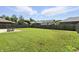 Lush backyard featuring a spacious grassy area, privacy fencing, and a patio with outdoor furniture at 1011 Stevedon Ct, Plainfield, IN 46168