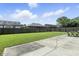 Expansive backyard featuring a well-maintained lawn, a patio area with seating, and a secure privacy fence at 1011 Stevedon Ct, Plainfield, IN 46168
