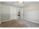 Bright bedroom featuring neutral walls and carpet, with a ceiling fan and a double door closet at 1011 Stevedon Ct, Plainfield, IN 46168