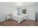 Bright bedroom with a large window providing natural light and a neutral color palette at 1011 Stevedon Ct, Plainfield, IN 46168