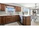 Bright kitchen featuring wood cabinets, stainless steel appliances, and a view of the backyard at 1011 Stevedon Ct, Plainfield, IN 46168