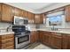 Well-equipped kitchen with stainless steel appliances and ample counter space at 1011 Stevedon Ct, Plainfield, IN 46168