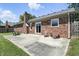 A charming brick home featuring a cozy patio with outdoor seating, perfect for enjoying the outdoors at 1011 Stevedon Ct, Plainfield, IN 46168