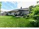 Backyard patio with outdoor seating, grill, and lush greenery, perfect for entertaining at 10173 Stillwell Dr, Avon, IN 46123