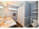 Bathroom featuring a double sink vanity, toilet, shower with curtain, and neutral wall color at 10173 Stillwell Dr, Avon, IN 46123