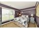 Bedroom with large window, featuring a queen bed and neutral walls at 10173 Stillwell Dr, Avon, IN 46123
