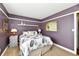 Bedroom featuring a queen bed, neutral walls, and decor at 10173 Stillwell Dr, Avon, IN 46123