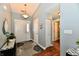 Bright foyer with hardwood floors, a decorative rug, and neutral paint color at 10173 Stillwell Dr, Avon, IN 46123