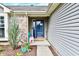 Inviting front entrance with a charming welcome sign and well-maintained landscaping at 10173 Stillwell Dr, Avon, IN 46123