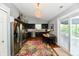 Bright kitchen with stainless steel appliances, eat-in area, and a sliding door to the patio at 10173 Stillwell Dr, Avon, IN 46123