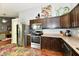This kitchen boasts stainless steel appliances, dark cabinetry, and functional design at 10173 Stillwell Dr, Avon, IN 46123