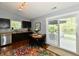 Cozy kitchen with dark cabinetry, stainless steel appliances, and dining table by the sliding glass door at 10173 Stillwell Dr, Avon, IN 46123