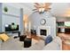 Bright living room with a fireplace, a large sectional sofa, and vaulted ceilings at 10173 Stillwell Dr, Avon, IN 46123