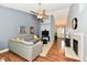 Inviting living room with a fireplace, hardwood floors, and comfortable seating arrangement at 10173 Stillwell Dr, Avon, IN 46123