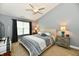 Tranquil main bedroom with carpet, a ceiling fan, and modern decor at 10173 Stillwell Dr, Avon, IN 46123