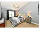 Comfortable main bedroom featuring a vaulted ceiling, carpet, and stylish furnishings at 10173 Stillwell Dr, Avon, IN 46123
