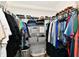 Walk-in closet with extensive shelving and racks for organized clothing and storage at 10173 Stillwell Dr, Avon, IN 46123