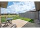 Relaxing back patio with outdoor seating, perfect for enjoying the serene backyard view at 114 Asbury Dr, Anderson, IN 46013