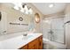 Bathroom featuring a single sink vanity, mirror, and shower with sliding glass doors at 114 Asbury Dr, Anderson, IN 46013