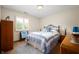 Cozy bedroom featuring a bed, wardrobe, a window with shutters and bedside tables at 114 Asbury Dr, Anderson, IN 46013
