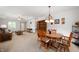 Charming dining area with a wooden table, leading into the living room, creating an inviting space at 114 Asbury Dr, Anderson, IN 46013
