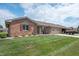 Attractive brick house with a well-kept lawn, a two-car garage, and a welcoming curb appeal at 114 Asbury Dr, Anderson, IN 46013
