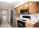A spacious kitchen features stainless steel refrigerator, microwave and modern appliances at 114 Asbury Dr, Anderson, IN 46013