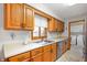 Well-lit kitchen boasts ample cabinet space, stainless steel appliances, and a window view at 114 Asbury Dr, Anderson, IN 46013