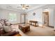 Bright living room with a cozy sofa, elegant tables, and a view of the front entrance at 114 Asbury Dr, Anderson, IN 46013