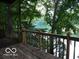 Wooden deck overlooking lush greenery and a lake at , Mooresville, IN 46158