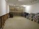 Unfinished basement space with exposed walls, shelving, and potential for customization at 1327 Goldfinch Dr, Carmel, IN 46032
