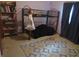 Bedroom featuring a metal bunk bed and a patterned rug on neutral carpet at 1327 Goldfinch Dr, Carmel, IN 46032