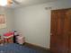 Bedroom featuring boxes, suitcases, and a door at 1327 Goldfinch Dr, Carmel, IN 46032