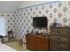 Bedroom featuring floral wallpaper, carpet, and standard window with blinds at 1327 Goldfinch Dr, Carmel, IN 46032