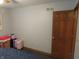 Bedroom featuring boxes, suitcases, and a door at 1327 Goldfinch Dr, Carmel, IN 46032
