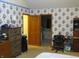 Bedroom featuring floral wallpaper, carpet, and standard window with blinds at 1327 Goldfinch Dr, Carmel, IN 46032