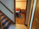 A dining room view featuring hardwood floors, a wooden table, and patterned wallpaper at 1327 Goldfinch Dr, Carmel, IN 46032