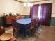 This dining room boasts wood furniture, a patterned rug, and a chandelier for an inviting atmosphere at 1327 Goldfinch Dr, Carmel, IN 46032