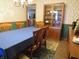 Traditional dining room features wood furniture, floral wallpaper, and access to the kitchen at 1327 Goldfinch Dr, Carmel, IN 46032