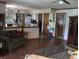 Open-concept kitchen features modern appliances and a breakfast bar overlooking the living area at 1327 Goldfinch Dr, Carmel, IN 46032