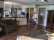Open-concept kitchen features modern appliances and a breakfast bar overlooking the living area at 1327 Goldfinch Dr, Carmel, IN 46032