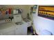 Laundry area features a washing machine, utility sink, and storage shelves for household supplies at 1327 Goldfinch Dr, Carmel, IN 46032