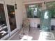 Bright sunroom with a chaise lounge and large windows, offering natural light and outdoor views at 1327 Goldfinch Dr, Carmel, IN 46032