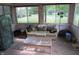 Bright sunroom featuring large windows, comfortable seating, and views of the outdoor lawn at 1327 Goldfinch Dr, Carmel, IN 46032