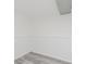 An empty basement with painted walls, gray wood-look floors, and a view of the white trim at 1537 Mutz Dr, Indianapolis, IN 46229