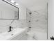 Modern bathroom featuring sleek black fixtures, marble-style tiles, and a clean, contemporary design at 1537 Mutz Dr, Indianapolis, IN 46229