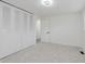 Large bedroom with carpet, natural light, and closet at 1537 Mutz Dr, Indianapolis, IN 46229